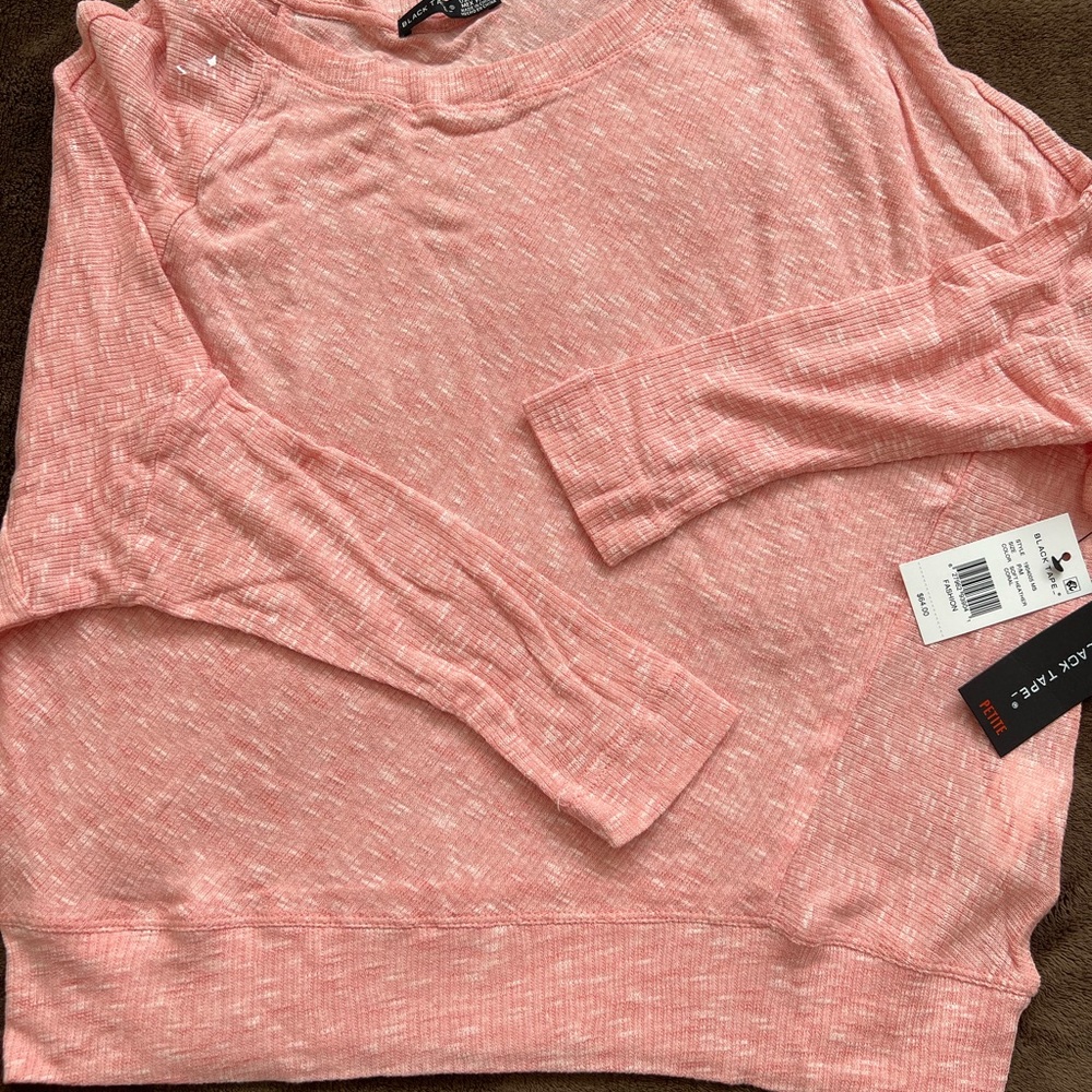 Black tape girls top , size petite medium, coral pink in color. Its brand new